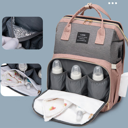 Sac à dos maman New Mummy – Lit de voyage intégré & compartiment isotherme